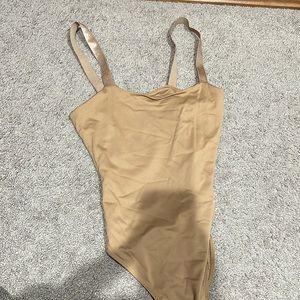 gold/tan body suit